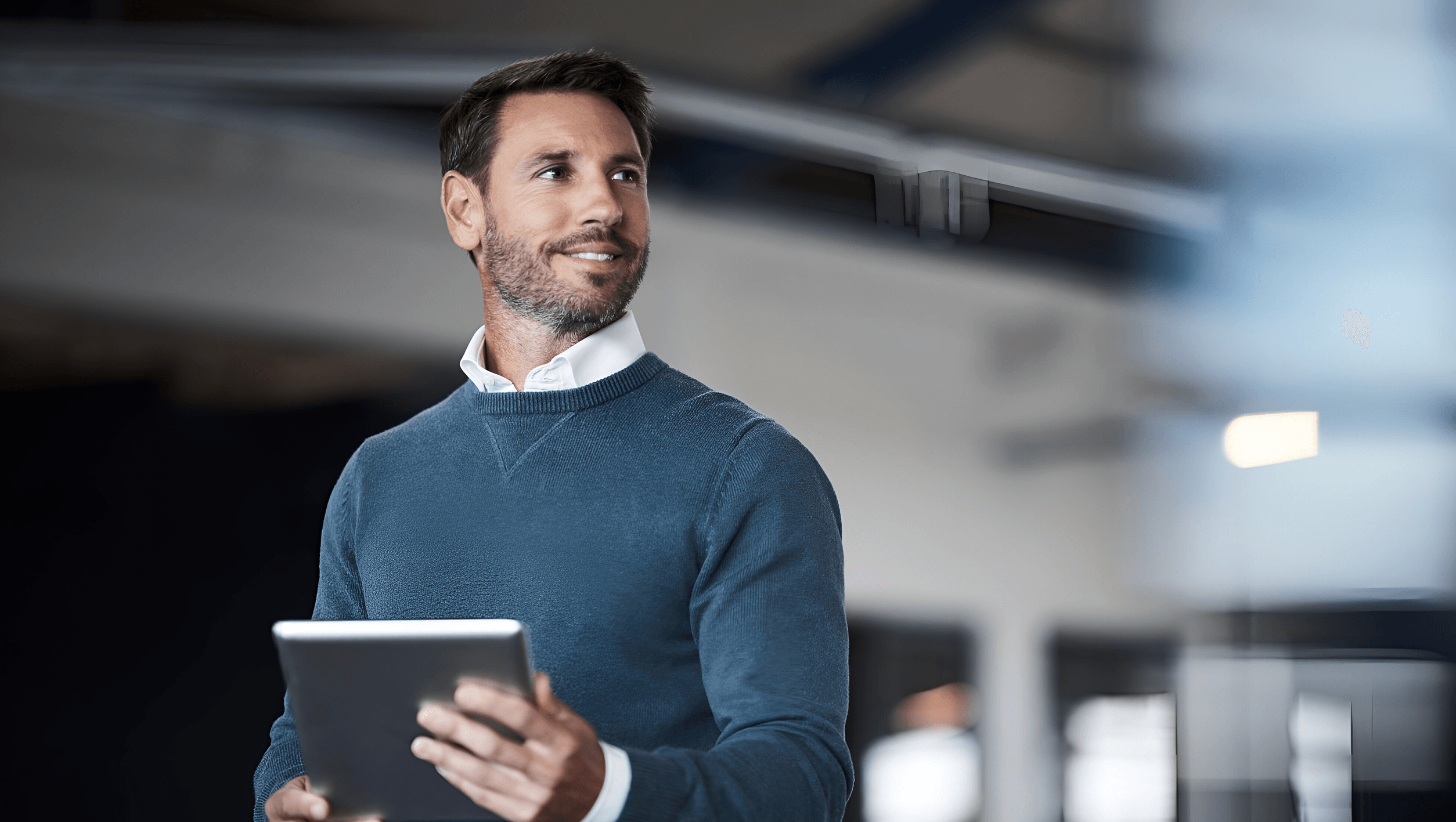 cropped-shot-mature-businessman-working-his-tablet-office 1.png
