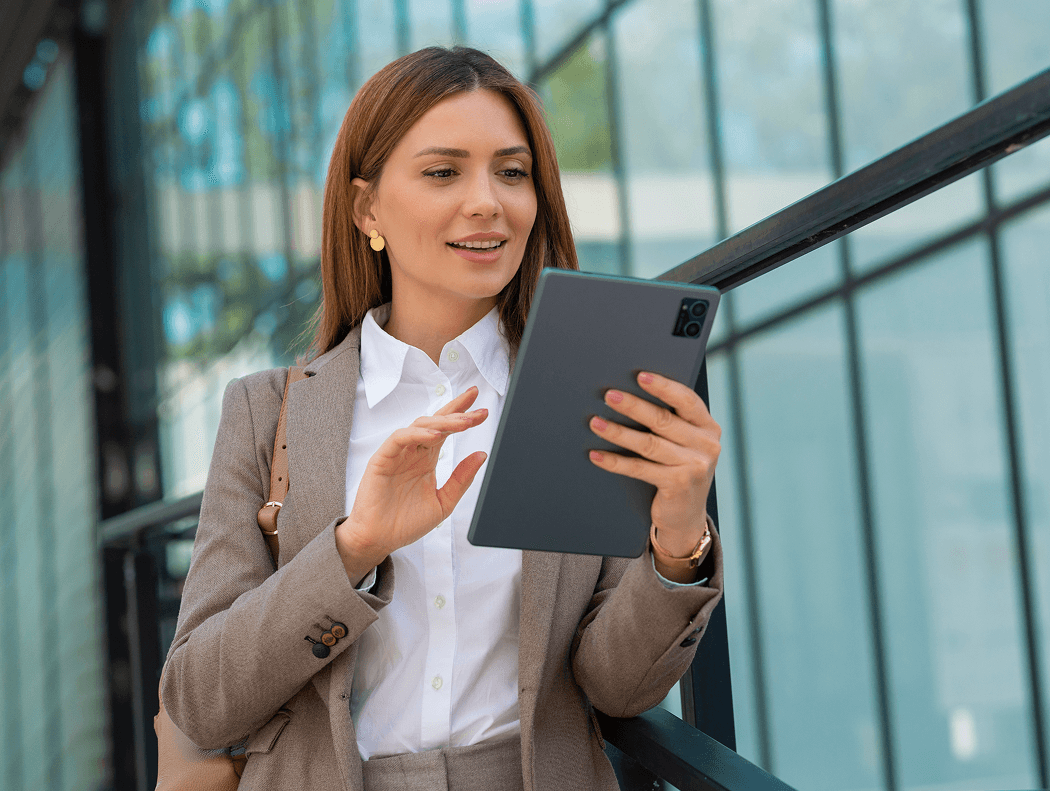 woman-is-holding-tablet-with-large-screen 1.png
